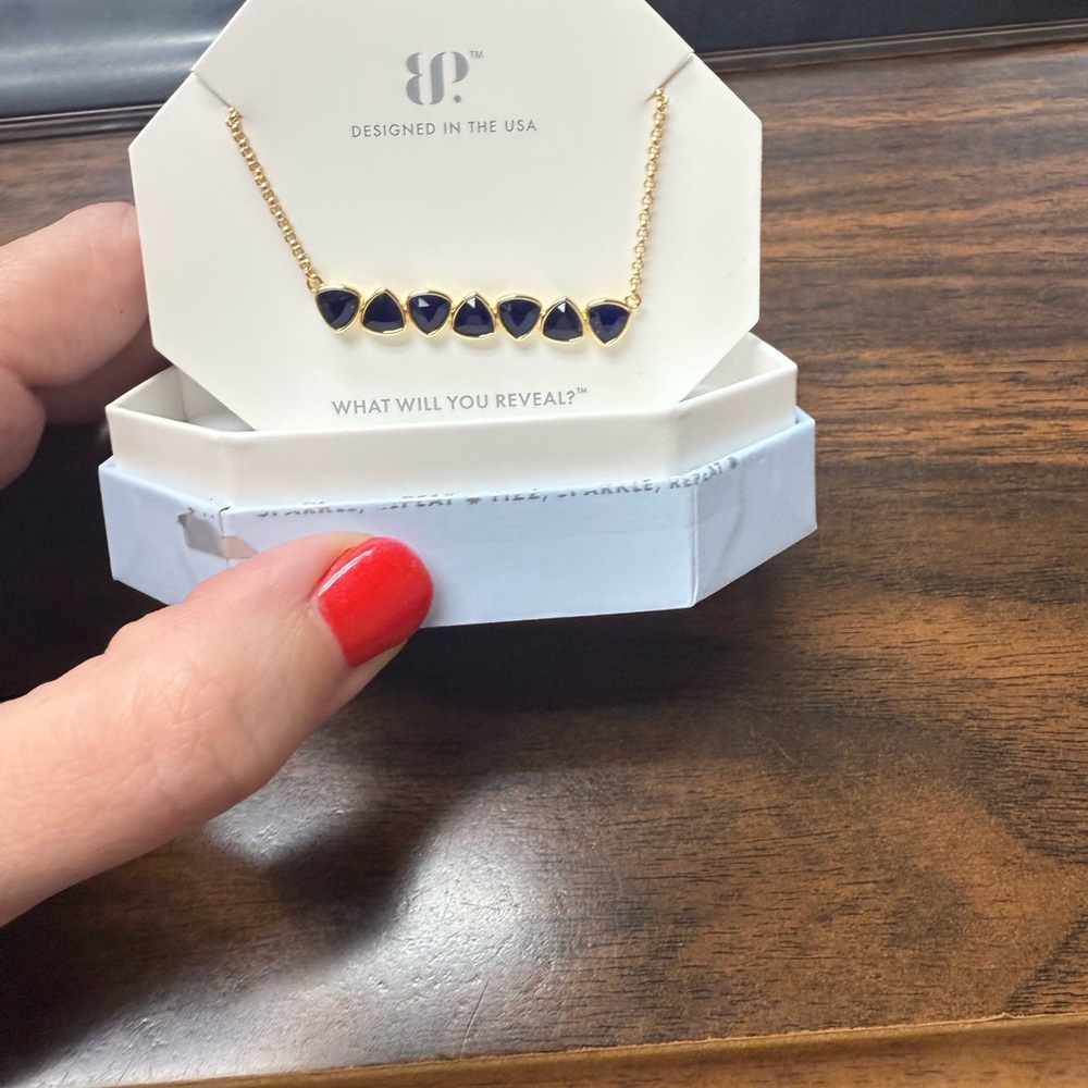 Held by the Invisible Bomb Party necklace
